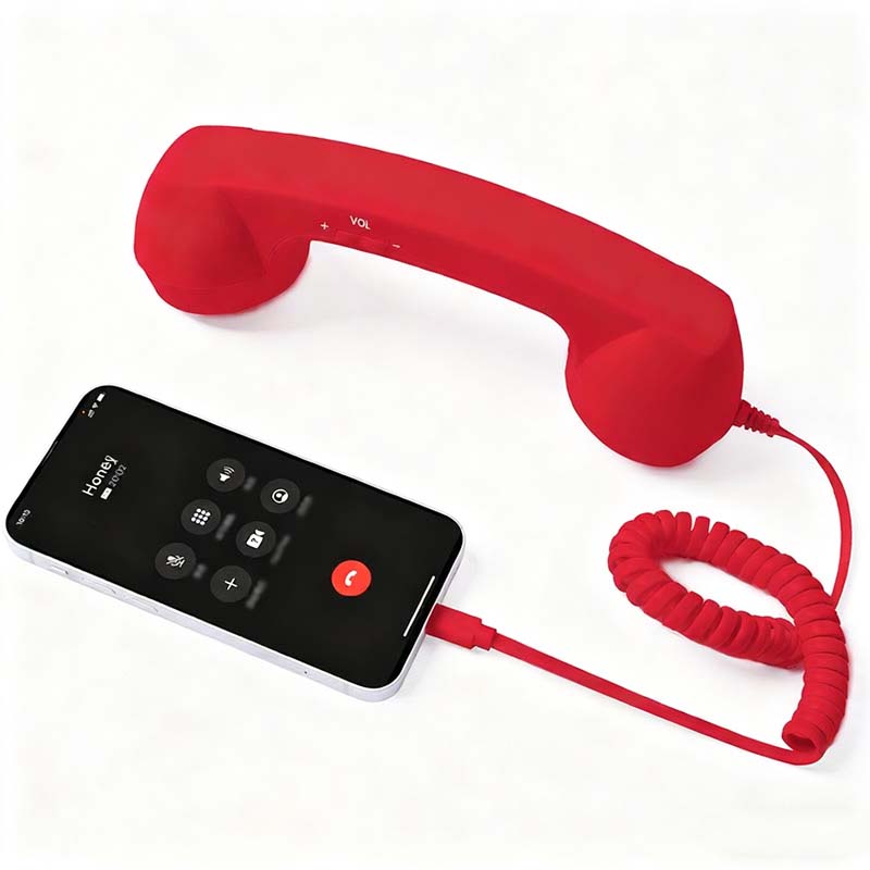 Vintage-Retro-Telefongriff mit Handy-Hörer und Mikrofon/Vintage retro telephone handle with mobile phone handset and microphone