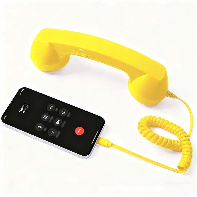 Vintage-Retro-Telefongriff mit Handy-Hörer und Mikrofon/Vintage retro telephone handle with mobile phone handset and microphone