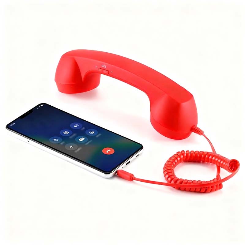Vintage-Retro-Telefongriff mit Handy-Hörer und Mikrofon/Vintage retro telephone handle with mobile phone handset and microphone